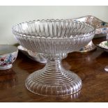 A Georgian cut glass footed bowl, possibly Irish, in two sections, the panel and prismatic cut