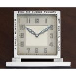 A clock with 8th Gurkha Rifles and military interest, the chrome Art Deco clock of square form on