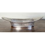 A George V reticulated silver bread basket, Barker Bros., Chester 1917, navette form with pierced
