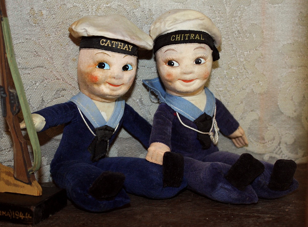 A pair of Norah Wellings cloth sailor dolls, with painted features and blue velvet sailors