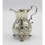 A George IV silver baluster cream jug, of diminutive proportions, London 1827 by John Hawkins, with