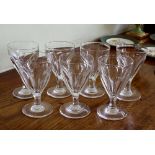 A set of seven early Victorian cut glass wine goblets, c.1840, the drawn tulip bowls with petal