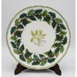 A 19th century porcelain Christmas plate, probably Copeland Spode, painted with a sprig of