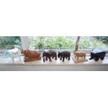 Six carved hardwood elephants, including one carved by a WW2 POW. (6),