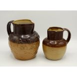 A Royal Doulton salt glazed stoneware hunting and harvest jug, two tone glaze, applied strap work