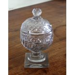 A Georgian cut glass sucrier and cover, globular form, with wave and diamond cut decoration, on
