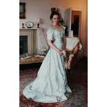 A Victorian two piece evening gown, in pale blue taffeta silk, with rufflette bow decoration to the