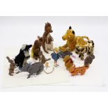 A set of Winnie the Pooh wooden cut out figures, 1930s, comprising Tigger, Eeyore, Winnie, Rabbit,