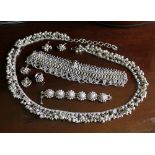 A silver Tibetan necklace, oval links with round finials, traditional chain link swag apron;