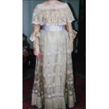 A Victorian lace two piece evening dress, the skirt with ivory silk underskirt and fine lace and