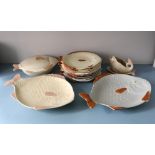 A Shorter & Son fish service, 1950s, of fish form, comprising twelve dinner plates, lidded entree