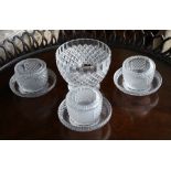 Three Georgian cut glass salts with stands, the cup shaped salts with comb cut rims over alternate