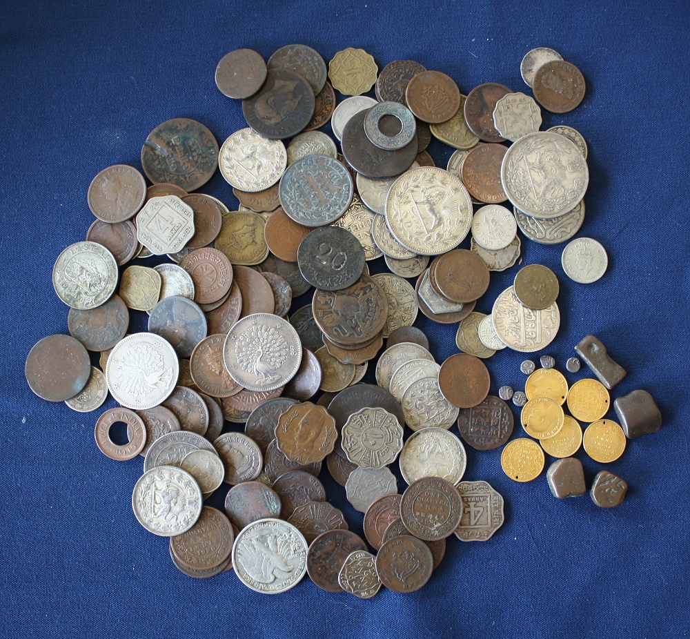 A collection of 19th and 20th century Indian & Nepalese coins, to include silver 1835 and 1917