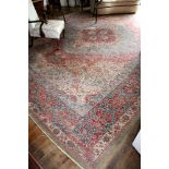 A large American Sarouk rug, early 20th century, the four pointed central medallion on a light blue