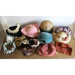 A collection of vintage hats and other head pieces, including Art Deco period skull caps, flapper