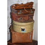 Five items of vintage luggage, comprising two small leather cases; a faux lizard skin circular hat