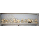 A large collection of carved ivory elephants, Indian and Oriental examples, some early 20th