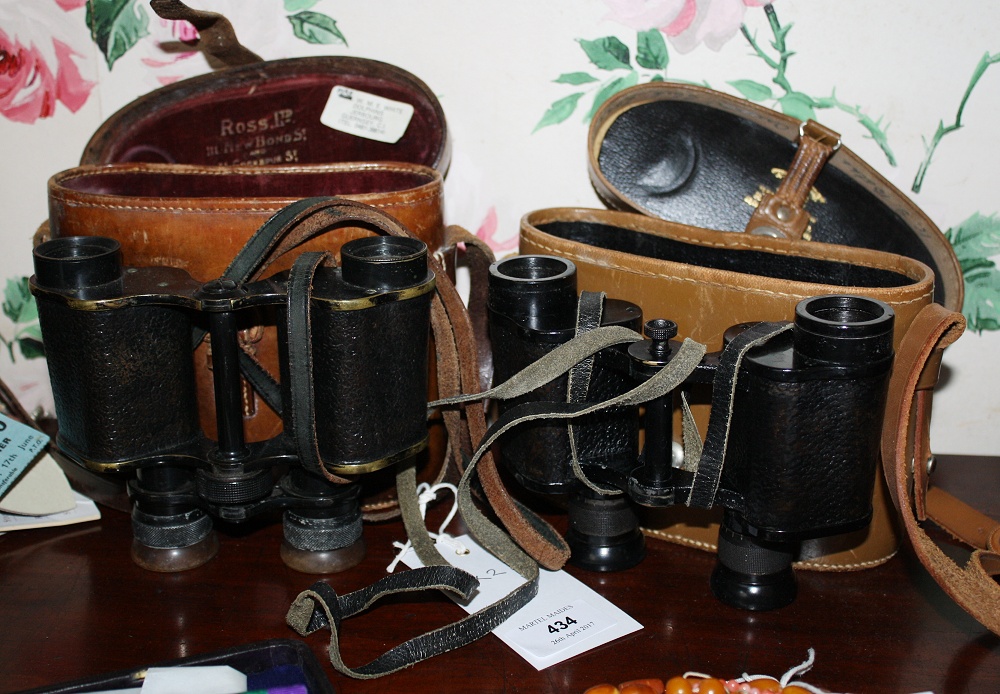 Two pairs of binoculars, by Ross of London, one pair serial number 63185, in brown leather case,