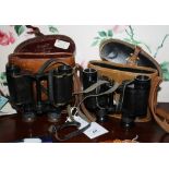 Two pairs of binoculars, by Ross of London, one pair serial number 63185, in brown leather case,