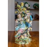 An English porcelain figural group, late 18th / early 19th century, possibly Derby, depicting a