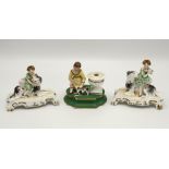 A pair of Staffordshire figures of children with dogs, second quarter 19th century, the dogs