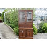 A Ercol Mural country style dresser in dark elm.