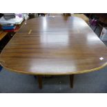 A vintage Morris of Glasgow dining table with hinged and swivel top, standing on four splayed