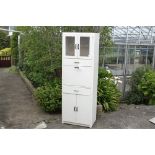 A white painted 1950's kitchen larder or cupboard.