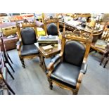 A set of three oak Gothic throne chairs, with black leather studded upholstery, Provenance: from