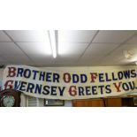 A vintage Oddfellows Loyal Guernsey Lodge handpainted street banner, 1932, with original brown paper