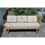 A vintage Ercol Day bed with original cushions.