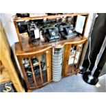 A 1950/60's drinks cabinet with centre revolving bottle compartment.