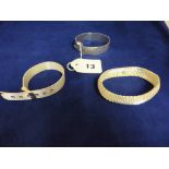 Three various ladies silver bangles.