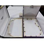 Two freshwater pearl necklaces with 9ct gold clasps.