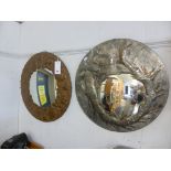 Two circular mirrors, one with metal embossed dragon design, one copper embossed with fauna