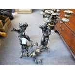 A pair of bronze cherub candlesticks a/f.