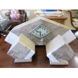 An Art Deco marble three piece clock garniture.