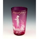 A rare Guernsey souvenir cranberry glass tumbler with Mary Gregory style decoration, c.1900, the