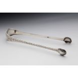 A scarce pair of Channel Islands silver shell bowl bright cut sugar tongs, maker's mark IS, struck