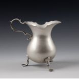 A rare George II Channel Islands silver cream jug, maker's mark GH struck three times to base (
