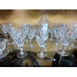 A large collection of vintage Waterford glassto include a Hurricane lamp; eight footed desert bowls;