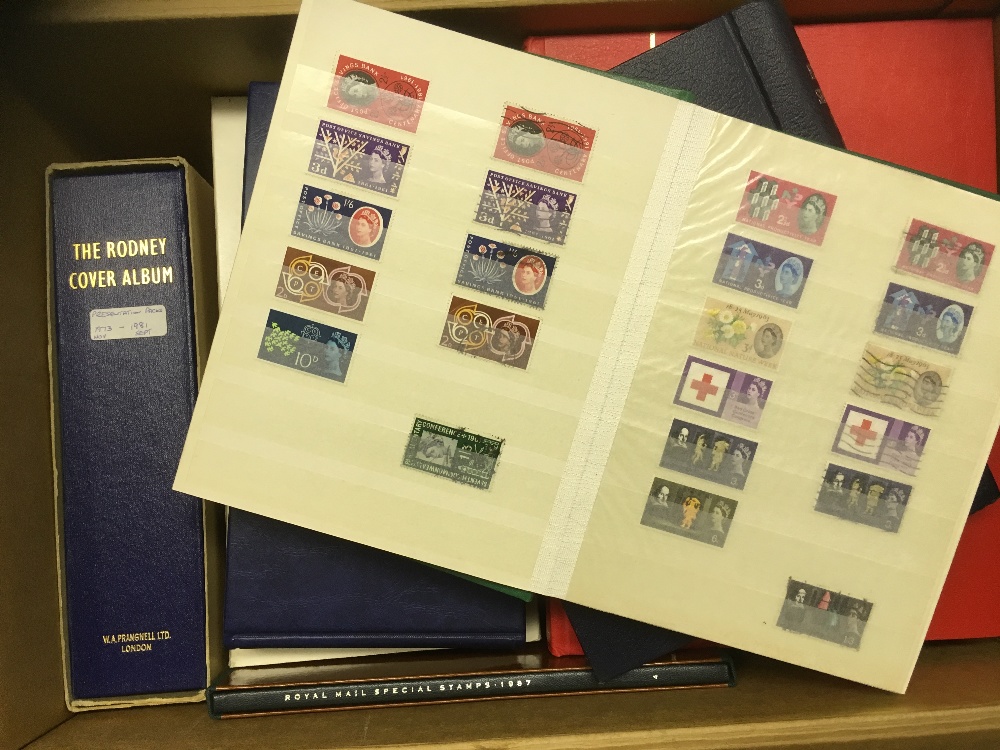 STAMPS : World accumulation of stamps and GB first day covers and presentation packs in 13 albums