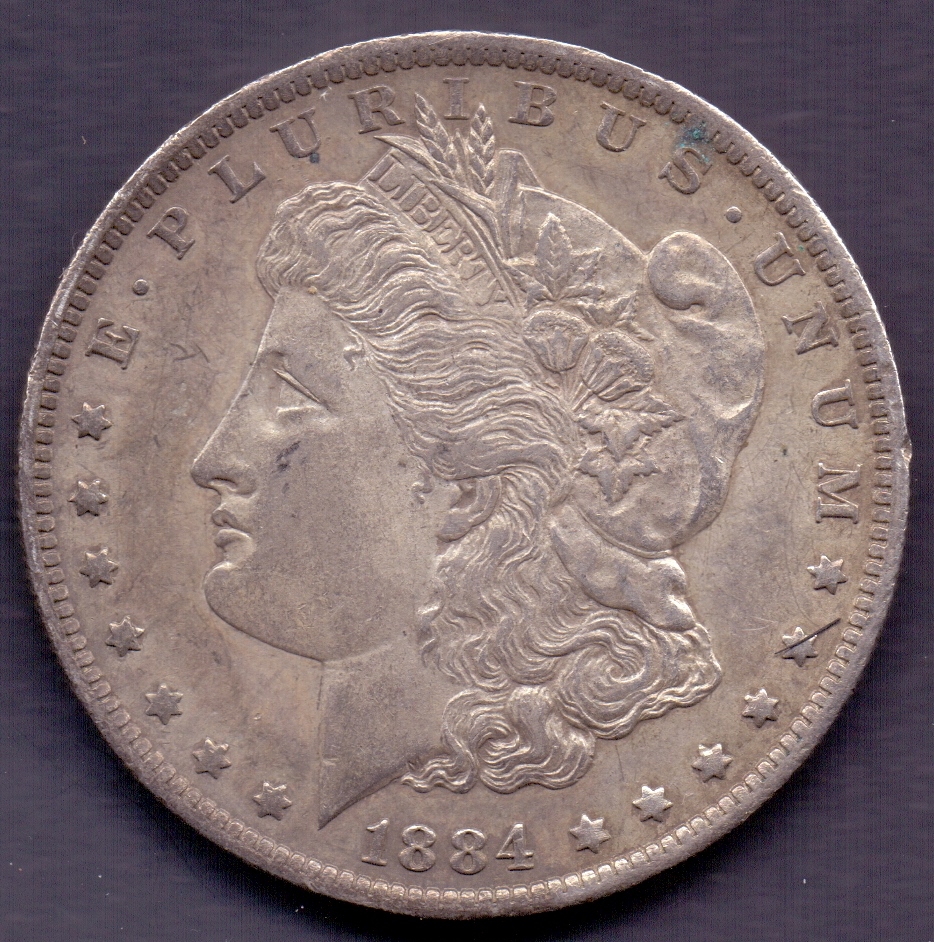 COINS : 1884 US $1 in reasonable condition, always a sought after classic Silver Coin 26.