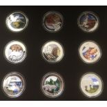 COINS : Fantastic collection in a plush display case of 9 silver enamelled Polish coins/medallions,