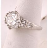 Diamond Solitaire Ring of Approximately 3.5 Carats Set on Platinum Band with Further Diamond