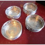 Set of Four Early Solid Silver Wine Coasters of Open Fret Circular Design