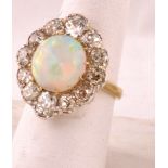 Victorian Cabochon Opal and Diamond Cluster Ring Set on 18 Carat Gold Band with Surrounding Diamonds