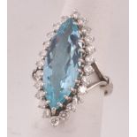 Marquise Cut Aquamarine Ring Circa 1960 Surrounded by Twenty Four Diamonds Claw Set on 18 Carat