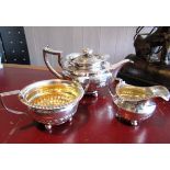 Antique Solid Silver Three Part Tea Set with Embossed Decoration above Bun Supports