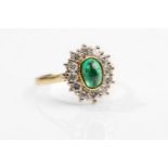 Emerald and Diamond Cluster Ring, the Colet-Set Oval-Cut Cabochon Emerald within a Surround of